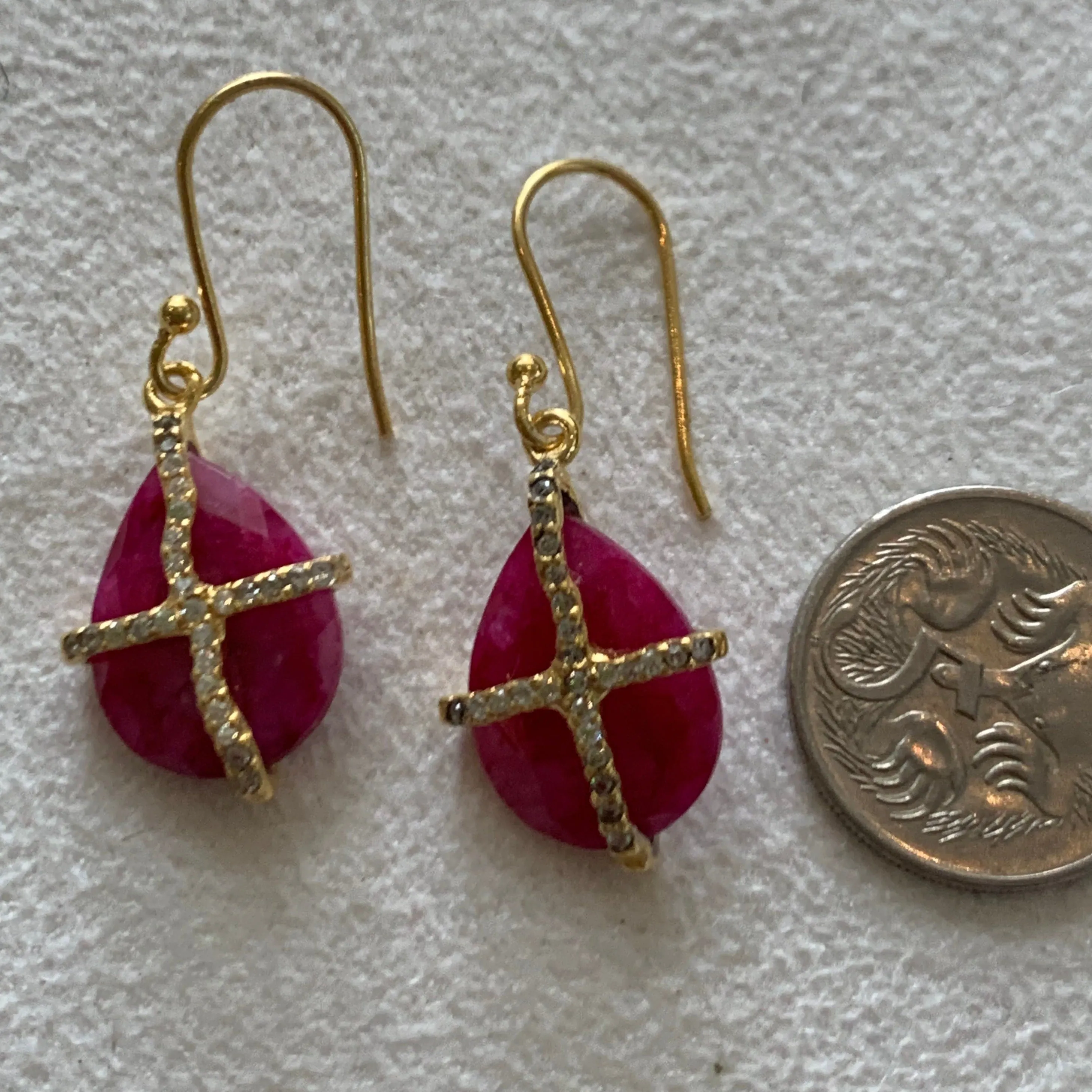 Teardrop Ruby with a sparkely cross AGP 0033E